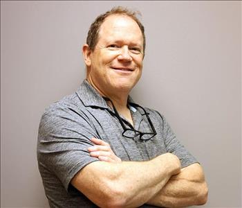SERVPRO Employee in front of a gray background