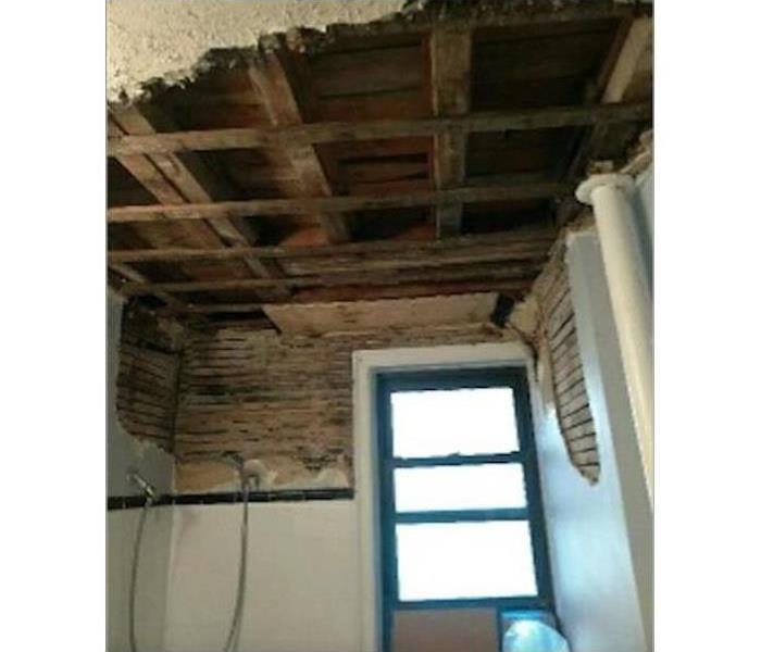 Bathroom ceiling damaged by mold